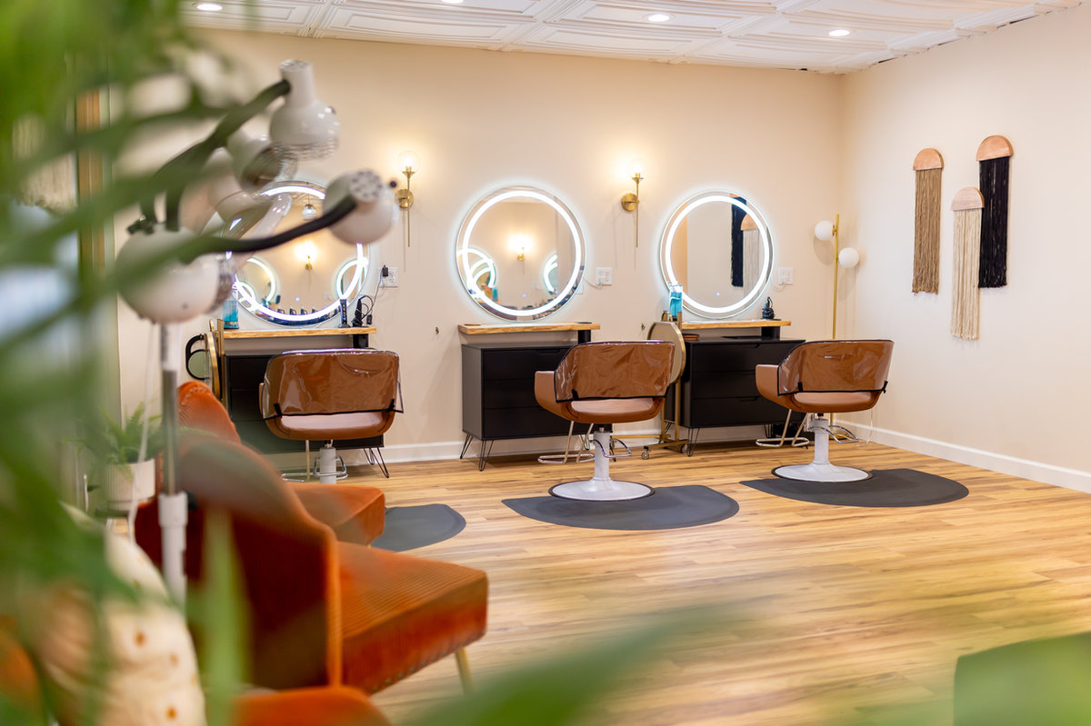 Waiting area with mirrors at Solace Salon