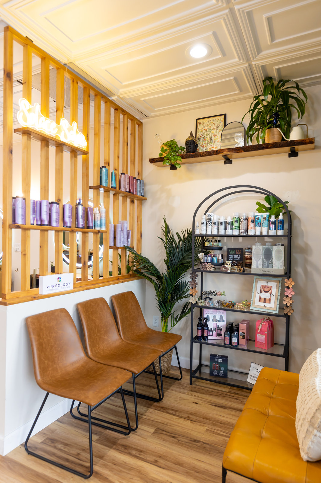 Retail shelves and waiting chairs at Solace Salon
