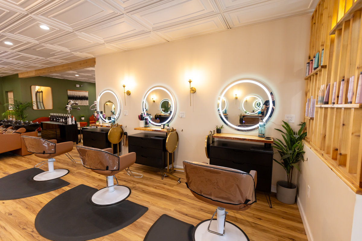 Styling chairs and arched mirror at Solace Salon