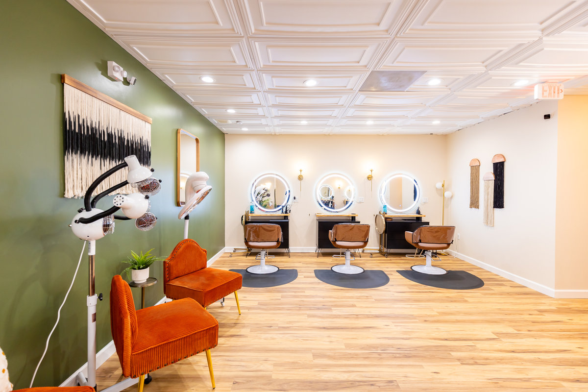 Orange waiting chairs in the Solace Salon lounge