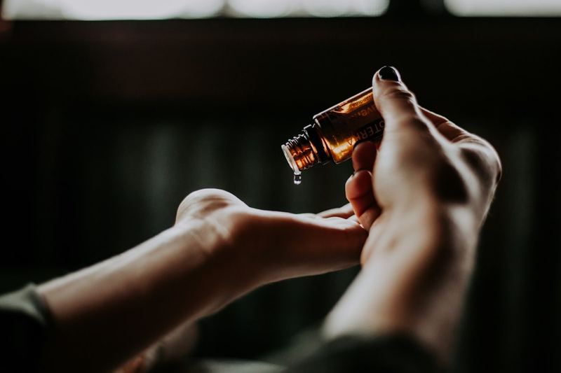 Aromatherapy oil being blended by hand